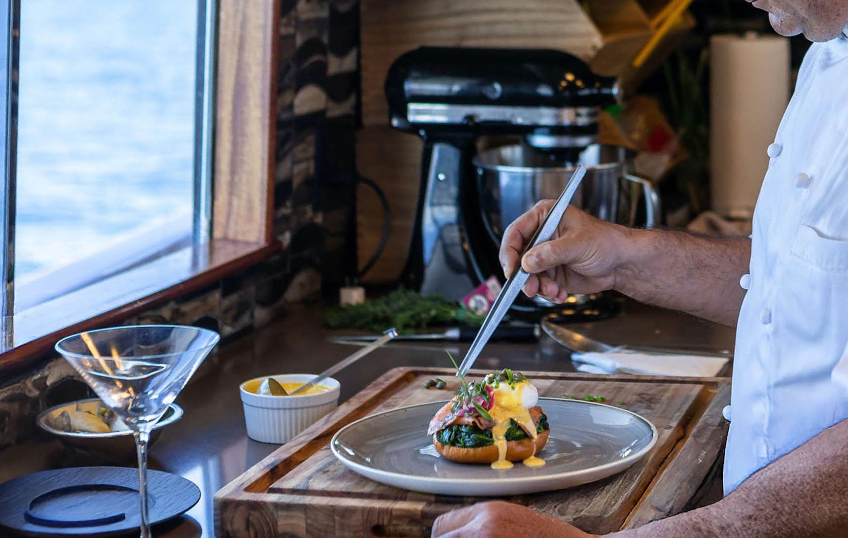 Chef plating in a yacht galley